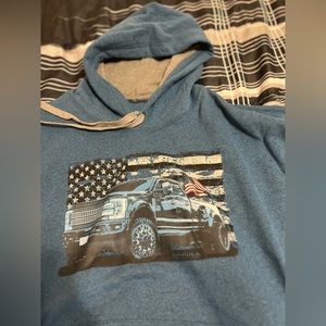 This is a size large, Lincoln Outfitters blue truck and flag hoodie